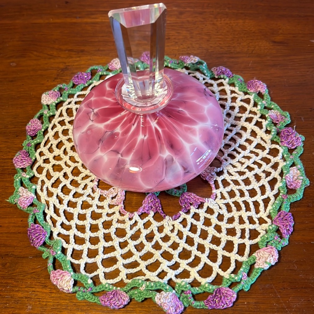 Perfume bottle magenta pink white mottled with clear glass bevel stopper.